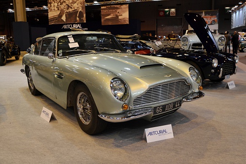 Paris, France, February 6th, 2014: The presentation of Aston Martin DB6 Vantage Coupe on the Retromobile Motor Show in Paris. This roadster is one of the most expensive classic car with 60s. Presented model was built in 1966. The DB6 model was powered by 6-cylinder petrol engine (325 HP).