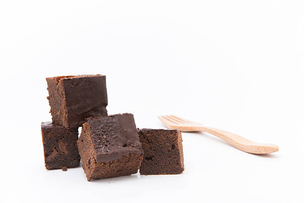 istock Pile of brownies isolated on white 525969060