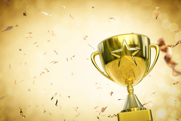 gold star trophy gold star trophy on gold background win prizes stock pictures, royalty-free photos & images