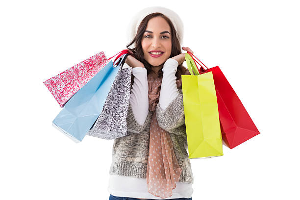 istock Brunette in winter clothes with shopping bags 525970467