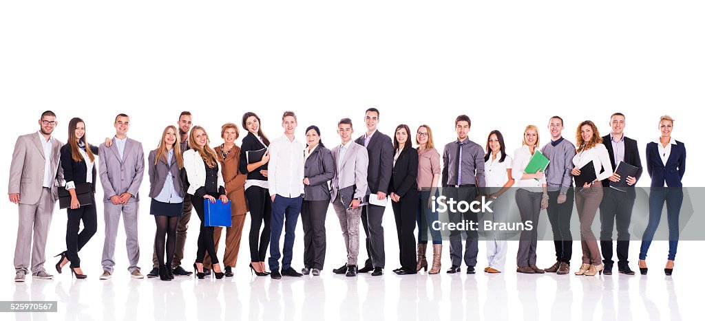 Smiling group of business people in a line. Large group of happy mixed-age business people standing in a line and looking at the camera. Isolated on white. Adult Stock Photo