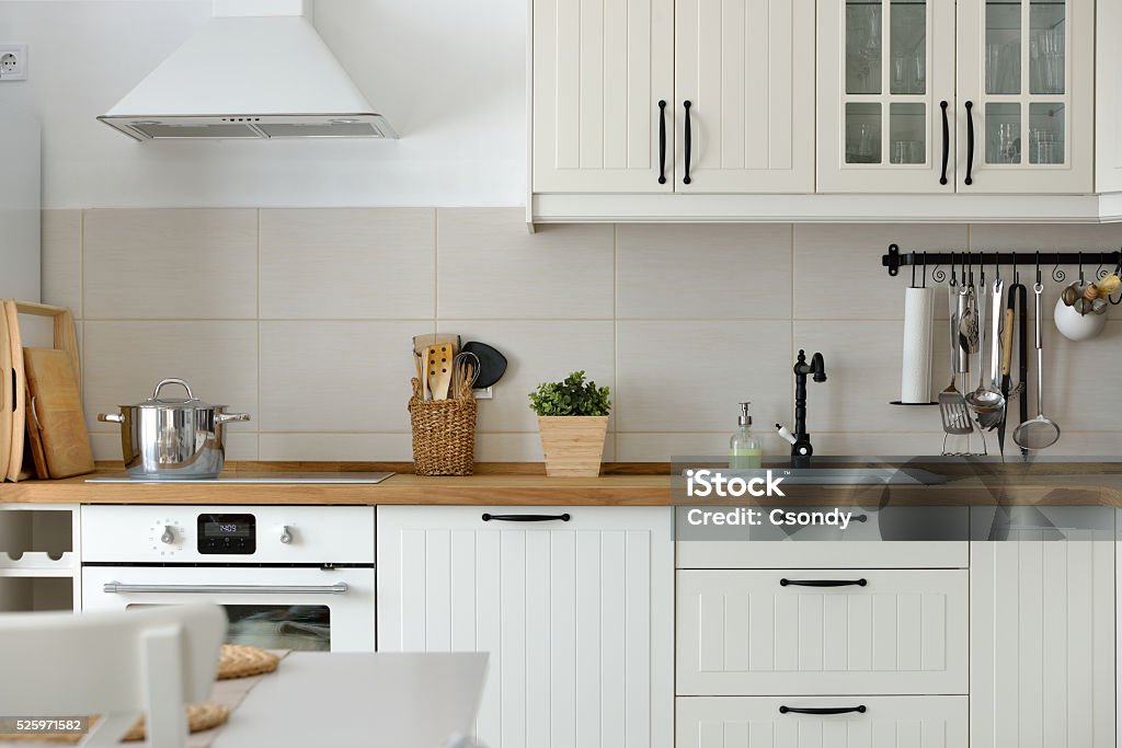 White European style kitchen Interior shot from a white Scandinavian style white kitchen in an apartment. Kitchen Stock Photo