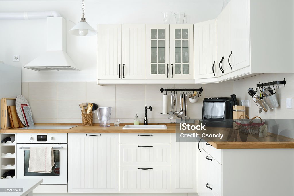 White European style kitchen Interior shot from a white Scandinavian style kitchen in an apartment. Kitchen Stock Photo