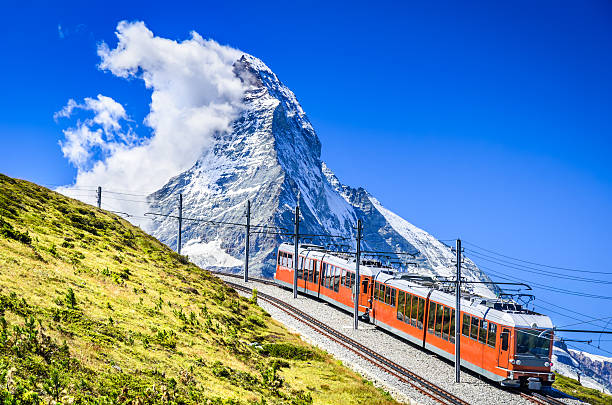 Gornergrat train and Matterhorn. Switzerland Matterhorn, Switzerland. Gornergratbahn is a 9 km long gauge mountain rack railway leading from Zermatt (1604 m), up to the Gornergrat (3089 m). matterhorn stock pictures, royalty-free photos & images