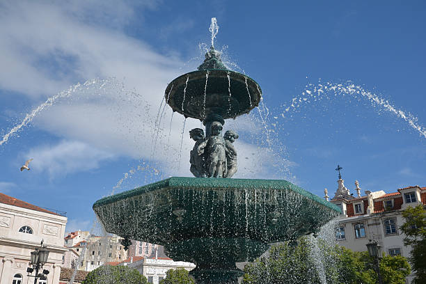 istock Rossio Square Fountain in Lisbon 525975412