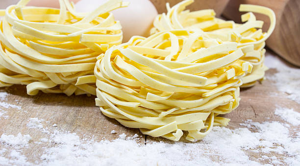 istock Raw homemade pasta and ingredients for pasta. 525975540