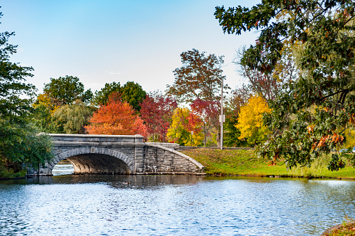 Stone bridge crossing lake in Roger Williams Park in Providence, Rhode Island