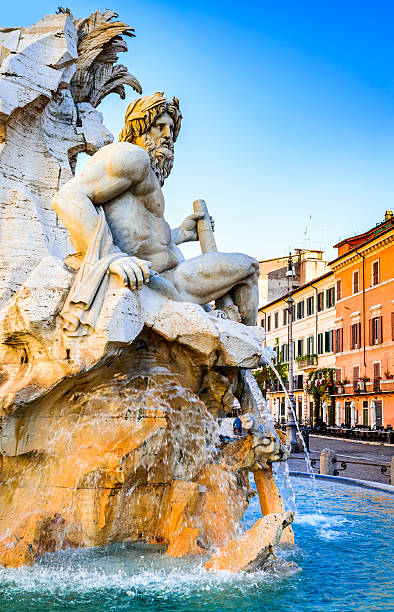 Piazza Navona, Rome in Italy Rome, Italy. Fountain of the Four Rivers (Fontana dei Quattro Fiumi) with an Egyptian obelisk. Piazza Navona is one of the most famous squares of Rome triton greek god stock pictures, royalty-free photos & images