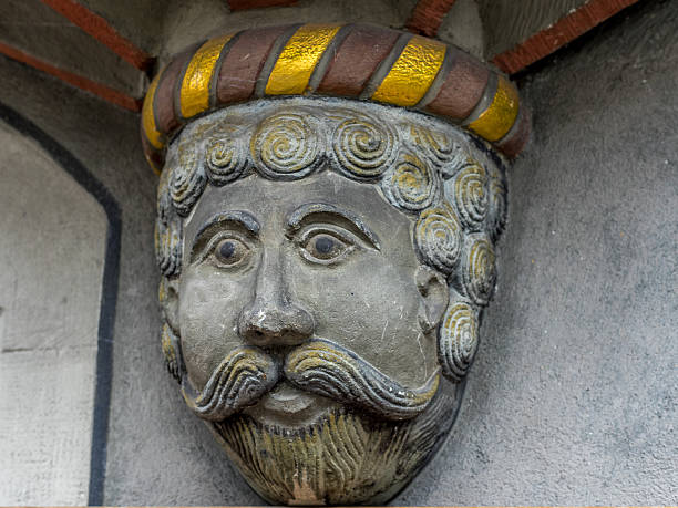 Mascaron on an old building facade of Kyiv Passage, Kyiv, Ukraine