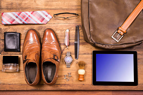 istock Men's accessories organized on table.  No people.  Knolling. 525979242