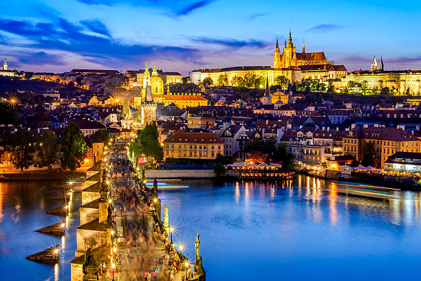 Prague Castle and Charles Bridge, Czech Republic Prague, Czech Republic. Charles Bridge and Hradcany (Prague Castle) with St. Vitus Cathedral and St. George church evening dusk, Bohemia landmark in Praha. hradcany castle stock pictures, royalty-free photos & images