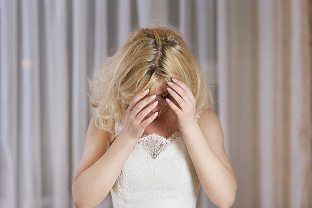 Shaggy beautiful woman with blond hair  on light background