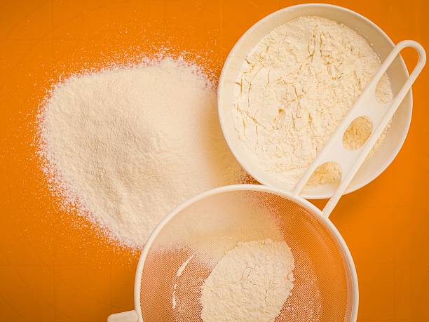 Preparation for baking, ingredients flour sifting.