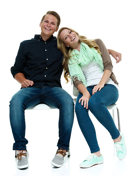 istock Couple on chair & looking at camera 525985247