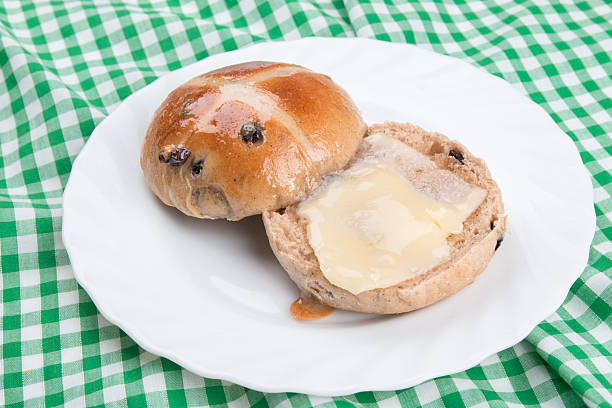 istock Hot cross bun on a white plate 525985971