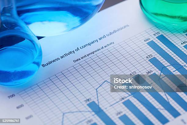 Glassware On Document Stock Photo - Download Image Now - Beaker, Biochemistry, Biotechnology