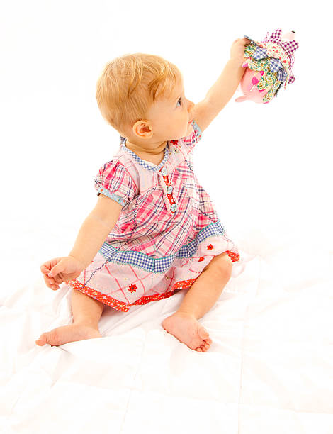istock little girl playing with a hedgehog 525987839