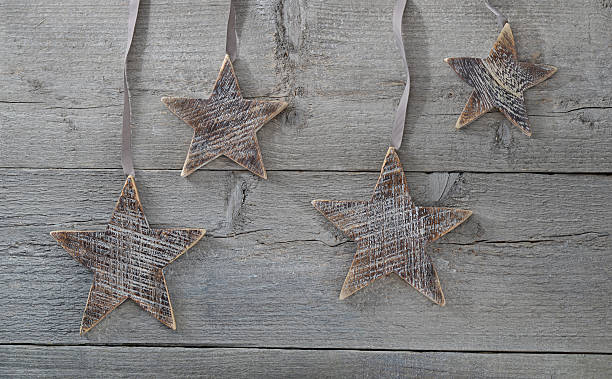 wooden stars decorations on wood stock photo