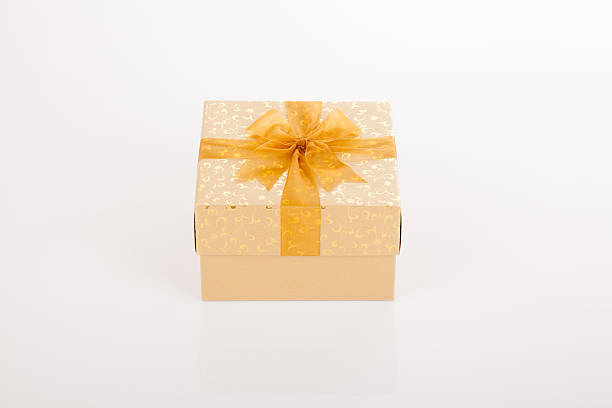 istock Golden gift box with golden bow on lid 525988639