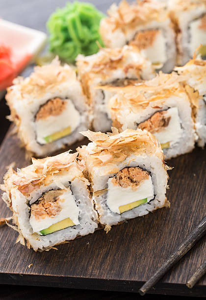istock Sushi rolls with salmon teriyaki 525989333
