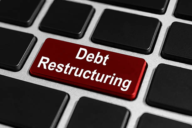 debt restructuring button on keyboard stock photo