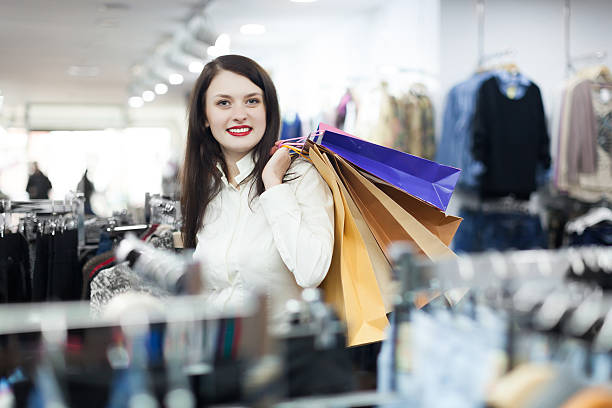 istock woman at clothing  store 525991339