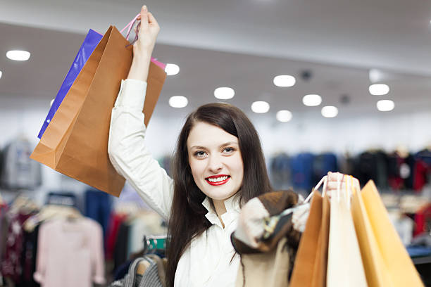 istock woman at clothing  store 525991509