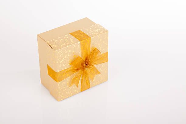 istock Golden gift box with golden bow 525991581