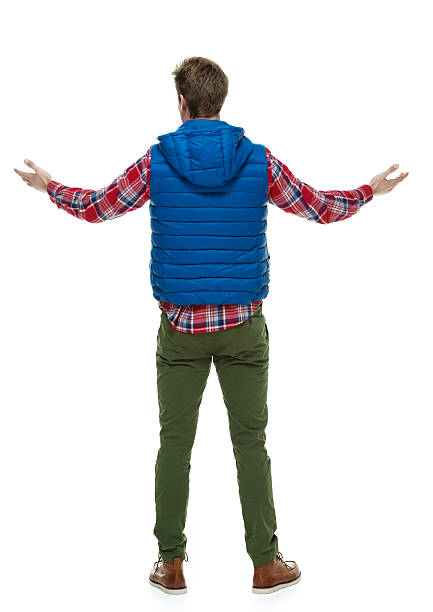 istock Rear view of hipster standing with arms outstretched 526018133