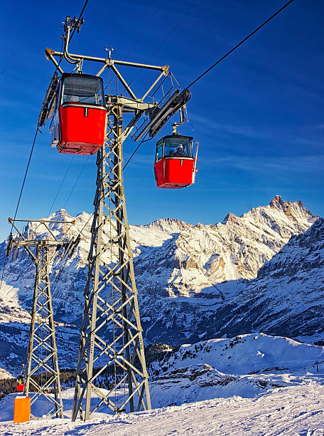 istock Red cable cars on the cable railway on winter resort 526018975