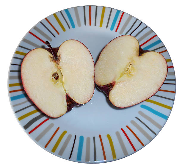 istock Two halves of an apple, isolated on white 526021113