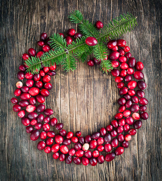 istock Natural Cranberries Wreath on Wooden Background. 526023705