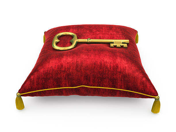 istock Golden key on royal red velvet pillow 526023955