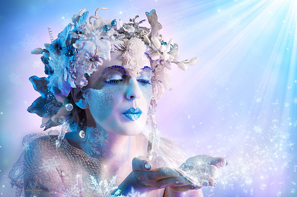 Winter portrait blowing snowflakes portrait of beautiful woman with winter style makeup snow fairy makeup stock pictures, royalty-free photos & images