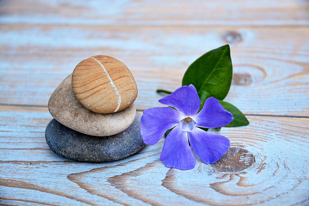 istock three zen stones on a wooden background 526036129