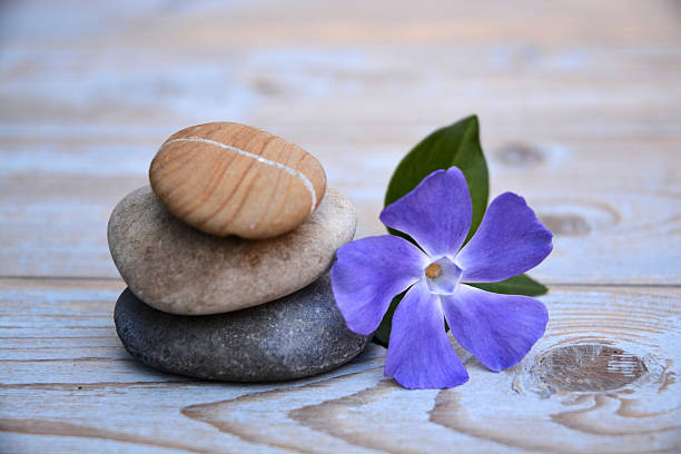 istock Three zen stones on a wooden background 526036131