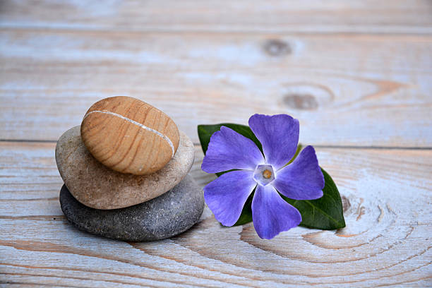 istock Three zen stones on a wooden background 526036143