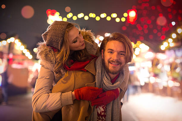 istock Couple having fun outdoors at winter fair. 526038797
