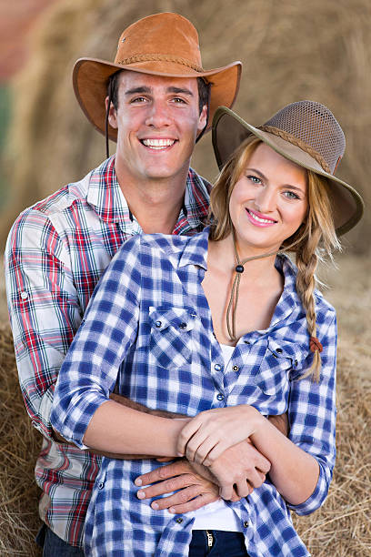 istock young farming couple inside barn 526039881