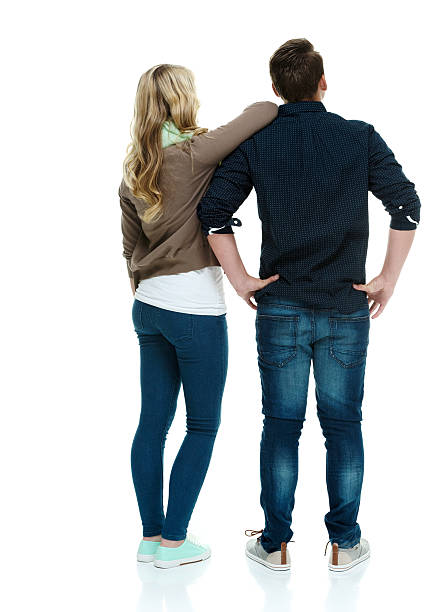 istock Rear view of couple standing & looking away 526041065