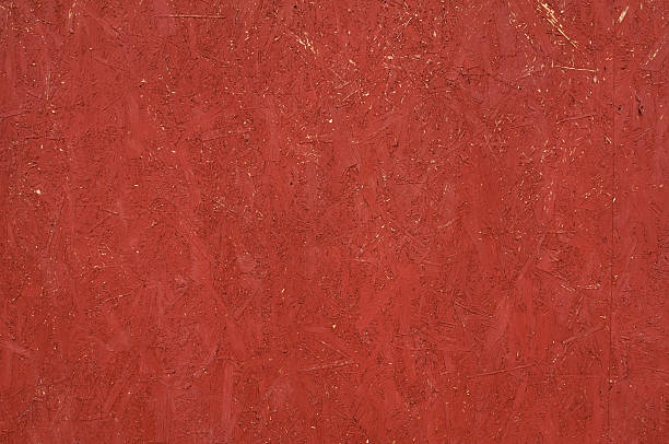 istock Texture of wall from chipboard, painted in red 526042147