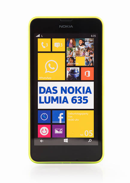 Nokia Lumia 635 with yellow frame, isolated on white Hamburg, Germany - October 17, 2014: Studio shot, isolated on a white background of a Nokia Lumia 635 Smartphone - Dummy . phone nokia stock pictures, royalty-free photos & images