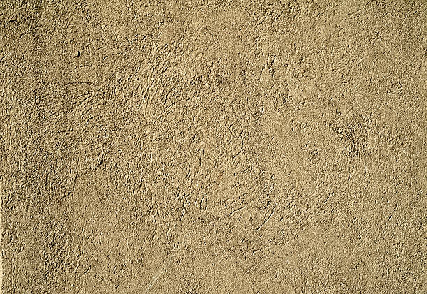 istock Texture of old wall covered with gray stucco 526055063