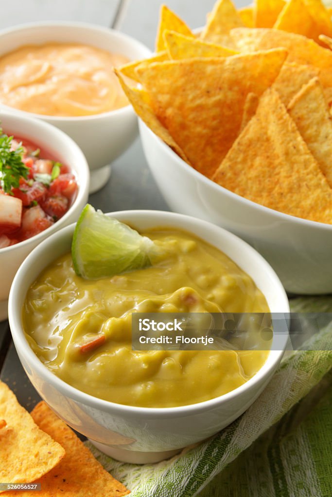 TexMex Food: Guacamole and Nachos TexMex Stills: Guacamole and Nachos Cheese Stock Photo