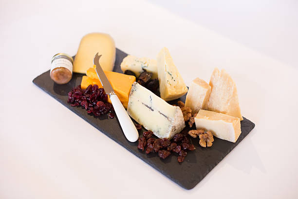 istock Plate or Tray with a Variety of cheeses 526057365