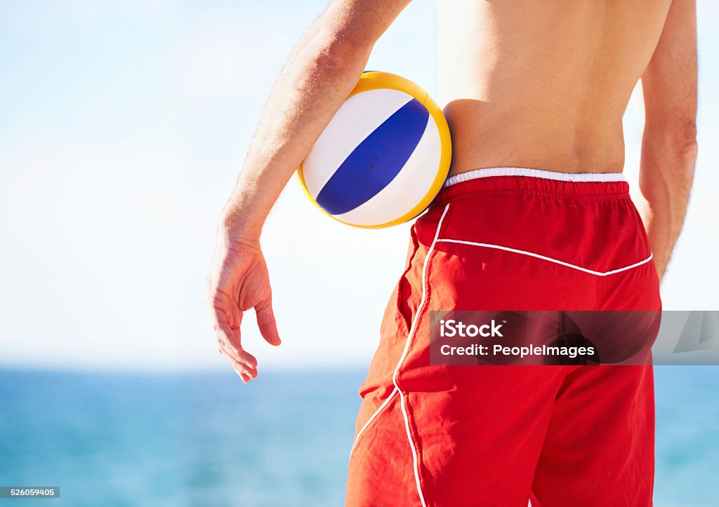 It's a glorious day Shot of a beach volleyball game on a sunny day 12 O'Clock Stock Photo