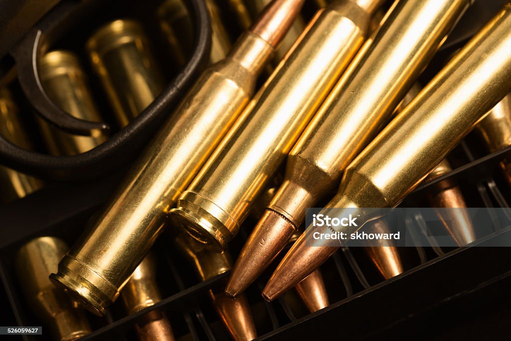 Rifle and Bullets Rifle and 7mm bullets. Ammunition Stock Photo