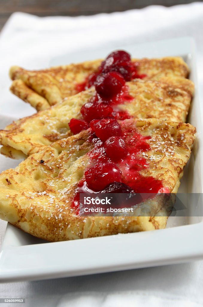 Swedish Pancakes Homemade Swedish pancakes with berry compote. Breakfast Stock Photo