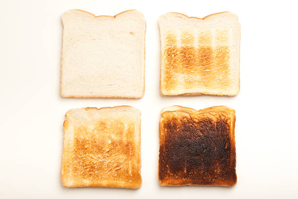 istock Four slices of toasted bread, white to black 526060167