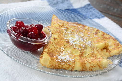 Homemade Swedish pancakes with berry compote.
